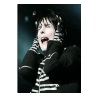 a man in a black and white striped shirt is covering his ears