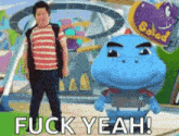 a boy standing next to a stuffed animal that says " fuck yeah " on it