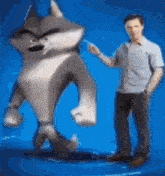 a man is standing next to a giant cartoon wolf on a blue background .