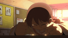a girl laying down with her eyes closed in front of a bulletin board with japanese writing on it