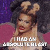 a drag queen says " i had an absolute blast " in front of a stuffed animal