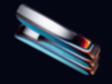 a close up of a blue stapler on a black background