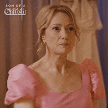 a woman in a pink dress with the word deal in white