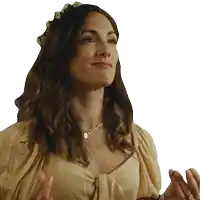 a woman wearing a flower crown and a necklace