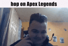 a man is talking on a cell phone with a caption that says hop on apex legends .