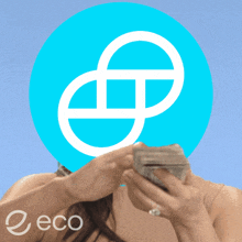 a woman is holding a bunch of money in front of a blue circle with a white e on it