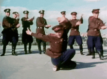 a group of soldiers are dancing on the ground