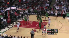 a basketball game is being played in a stadium that says chicago on it