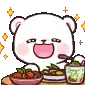 a white bear is sitting at a table with a bowl of food .