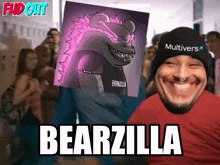 a man wearing a hat that says multivers holds a picture of a bearzilla behind him
