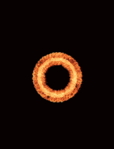 a large fireball with a hole in the middle of it