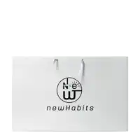 a white bag that says new habits on the front