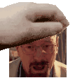 a man with glasses and a beard is wearing a hat and holding a towel over his head .