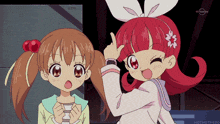 two anime girls are standing next to each other and one is pointing at the other