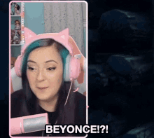 a woman wearing pink headphones and a cat ear headband says beyonce ?