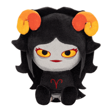 a stuffed animal with a ram 's horns and the letter r on it