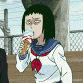 a cartoon girl is eating an ice cream cone with a sad face on her face .