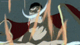 a cartoon character with a long white beard and a red cape is surrounded by flames .
