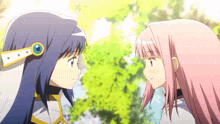 two anime girls are standing next to each other and smiling .