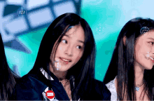 a girl with bubbles on her face has a red sticker on her jacket that says ' i love you '