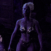 a woman in a purple bra and panties has blood on her body