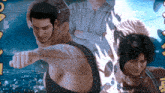 a man in a tank top is pointing at something in front of a sign that says ' tokyo '