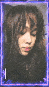 a girl 's face is surrounded by a purple and blue lightning frame
