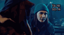 a woman in a green beanie is talking to another woman with the words " you are such an " written above her
