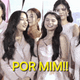 a group of women standing next to each other with the words por mimi written in yellow