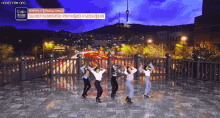 a group of women are dancing on a balcony with the words secret number written on the bottom