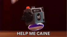 a video camera with the words help me caine written below it