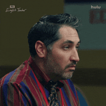 a close up of a man 's face with hulu written on the bottom