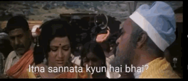 a man in a blue hat is talking to a woman with the words itna sannata kyun hai bhai written on the bottom