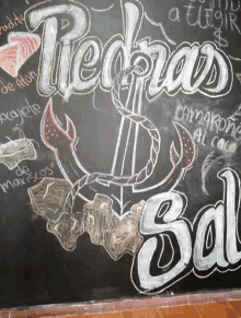 a chalkboard with a drawing of an anchor and the words " piedras sal " on it
