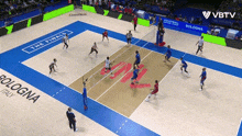 a volleyball game is being played on a court that says bologna on it