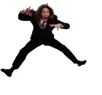 a woman in a suit is jumping in the air with her arms outstretched