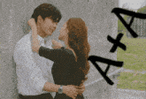a man and a woman are hugging each other with the letters a + a behind them