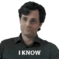 a man in a grey shirt has the word i know on his chest
