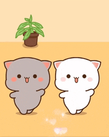 two cartoon cats are standing next to each other with a plant in the background