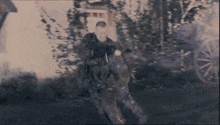 a group of soldiers are walking down a street in a blurry photo .