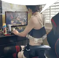 a woman sits in front of a samsung computer monitor