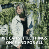 a man in a white jacket with the words " we can settle things once and for all " below him