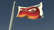 a flag with an angry face on it flies in the wind
