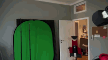 a room with a green screen behind it
