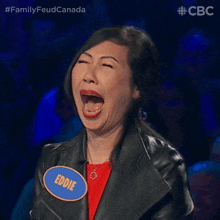a woman wearing a leather jacket and a name tag that says eddie