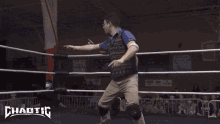 a wrestling ring with a banner that says ' chaotic ' on it
