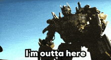 a robot with the words i 'm outta here written on it