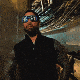 a man with a beard wearing sunglasses with the word yeast on them