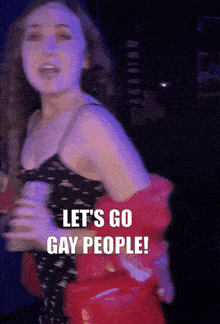 a woman says let 's go gay people in a dark room
