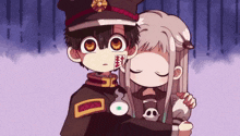a boy and a girl are hugging each other